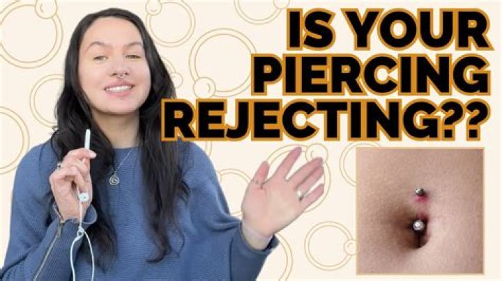 How do I know if my tongue piercing is rejecting?
