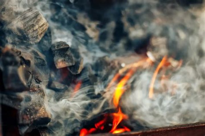 Why does my fireplace smell like smoke when it rains?